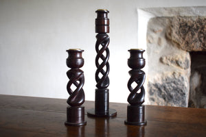 three wooden candlesticks