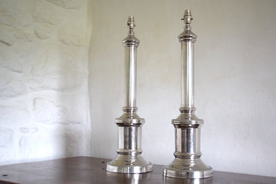 two large silver lamps
