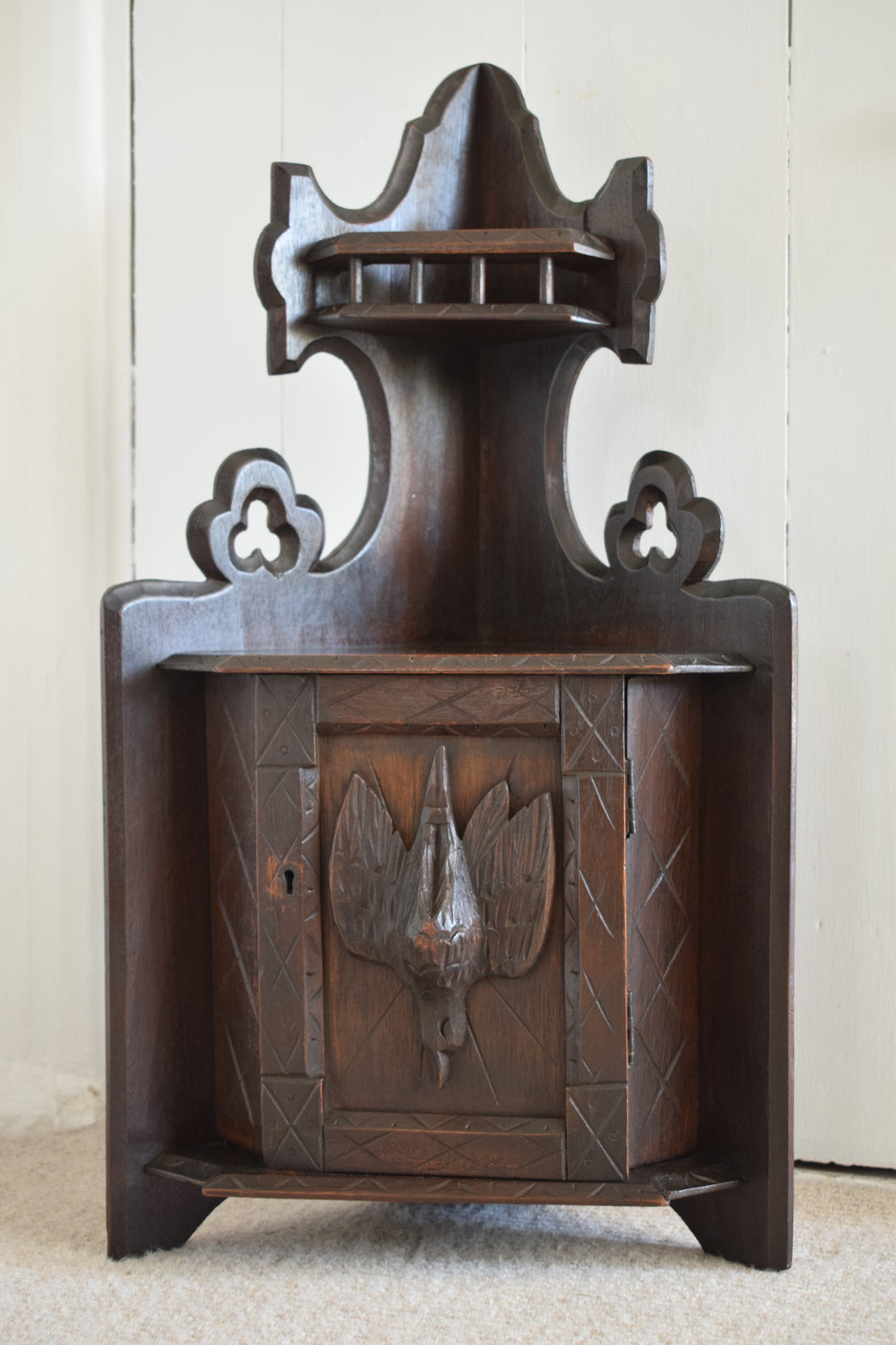 Small Oak Corner Cupboard with Carved Bird Panel Detail