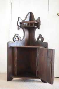 Small Oak Corner Cupboard with Carved Bird Panel Detail