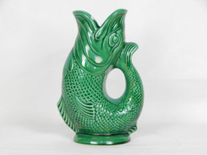 green pottery fish vase