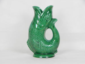 green pottery fish vase