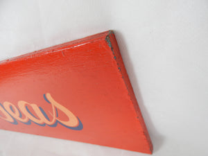 red painted shop sign