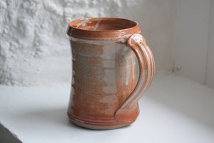 orange stoneware tankard