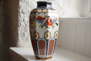 Vase decorated with orange flowers