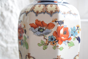 Vase decorated with orange flowers