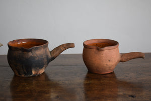 three earthenware pipkins