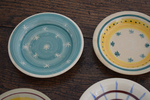 seven ceramic painted plates