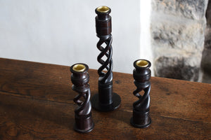 three wooden candlesticks
