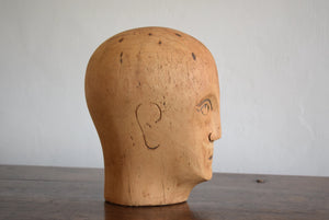 carved wooden head