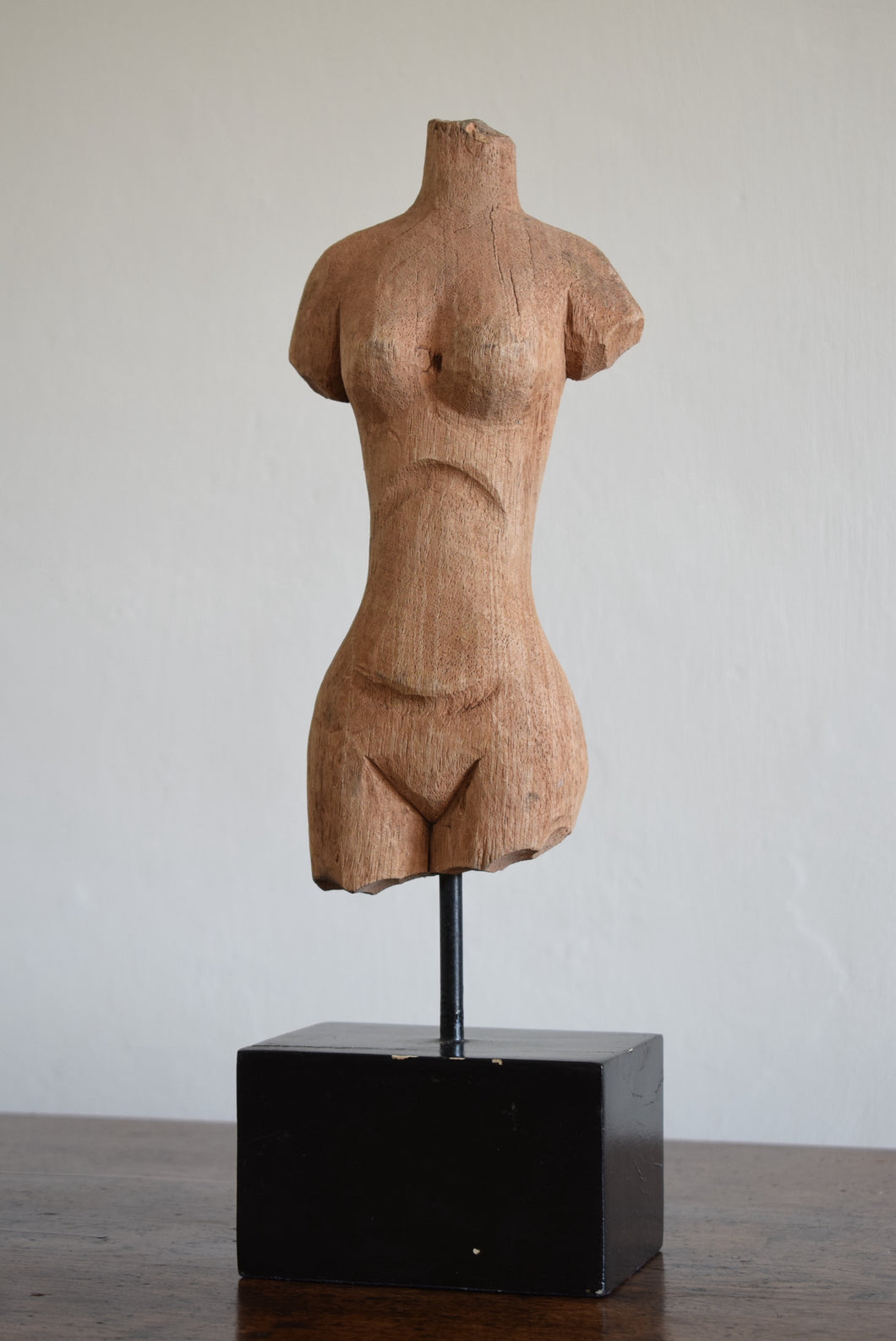 carved wooden torso