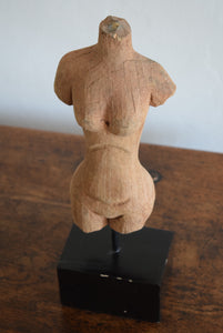carved wooden torso