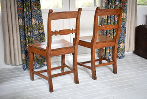 Antique pair of pitch pine chairs