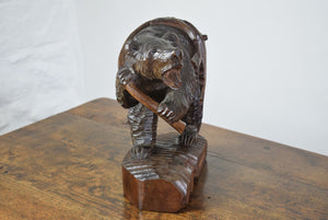 carved wooden bear with salmon