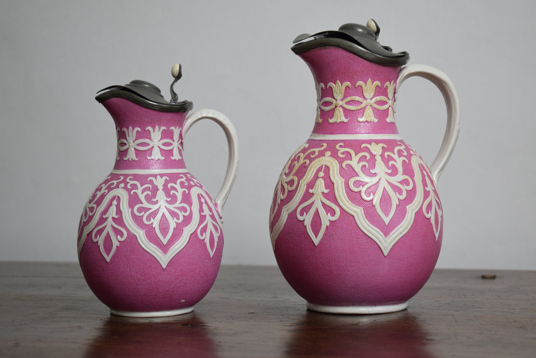 pair of pink ceramic jugs