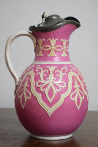 pair of pink ceramic jugs